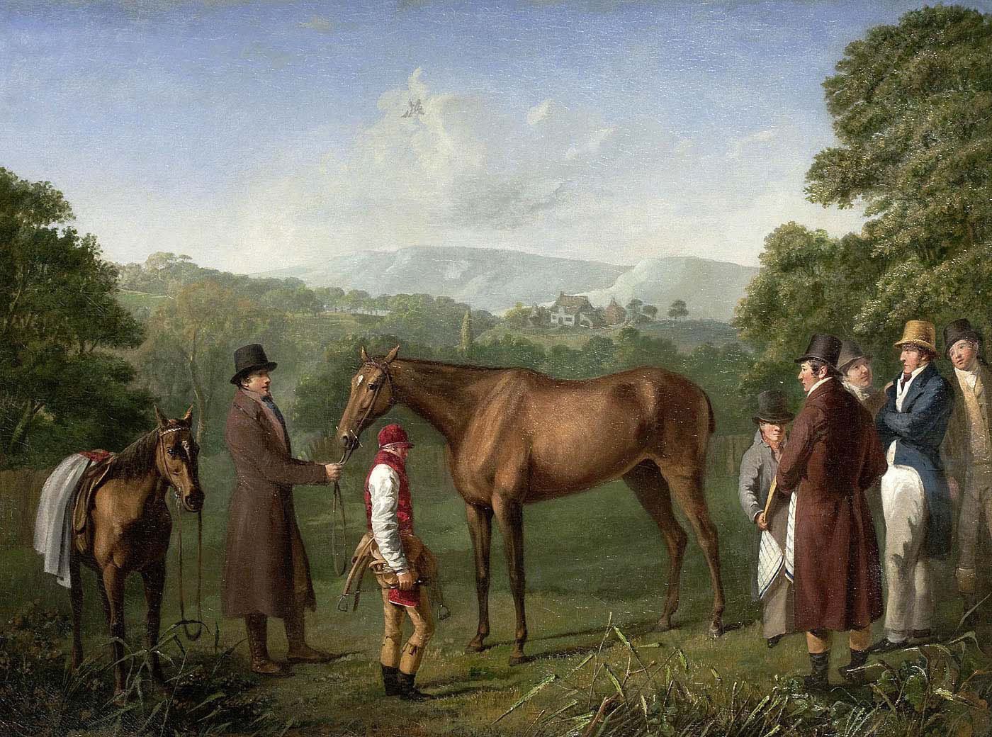 a bay racehorse held by a trainer